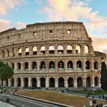 a view of the colosseum at sunset