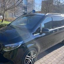 a black suv parked in a parking lot