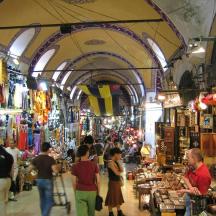 a group of people walking through a market