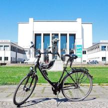 a bike is parked in front of a building