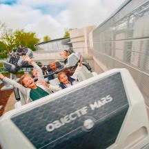 a group of people are sitting in an open bus