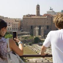 a man and a woman taking a picture of a city