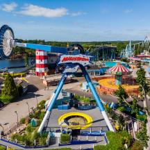 an aerial view of an amusement park with a roller coaster