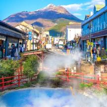 a town with a hot spring in the middle of a city