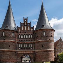 a large brick castle with three tall towers
