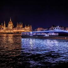 a boat on the water in front of a building