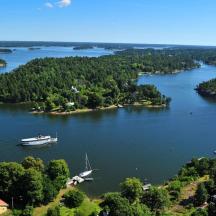 an aerial view of a boat on a lake