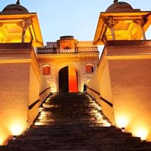 a stairway leading up to a building with lights