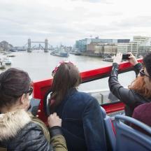 a group of people taking pictures of a river