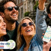a group of people holding up a cell phone