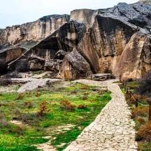 a stone path in a field with rocks