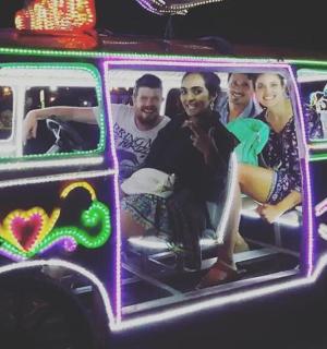 a group of people sitting inside of a van