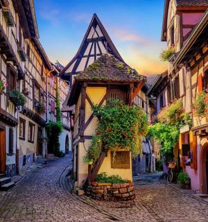 an alley in an old town with a building