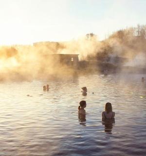 a group of people swimming in the water