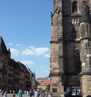 a group of people walking in front of a building