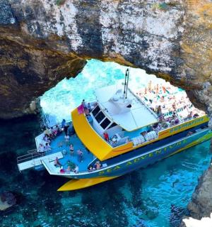a group of people on a boat in a cave