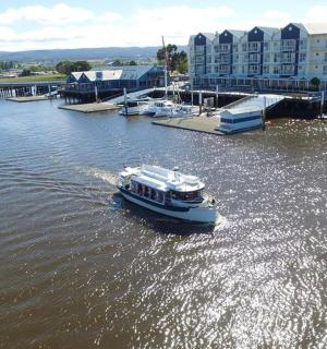 a small boat in the water in a marina