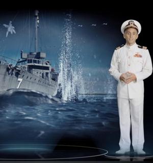 a man in uniform standing in front of a ship