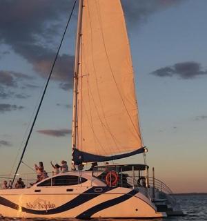 a group of people on a sail boat in the water