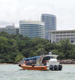 a group of people on a boat in the water