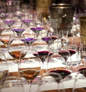 a bunch of wine glasses sitting on a table