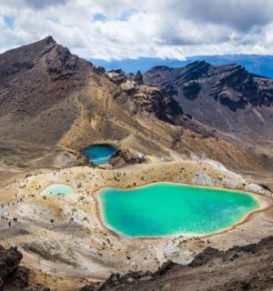 two turquoise lakes on the side of a mountain