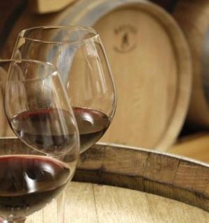 two glasses of wine sitting on top of a table