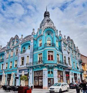 a blue and white building on a city street