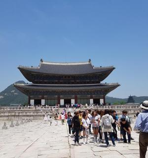 a group of people standing in front of a building