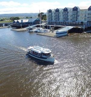 a small boat in the water in a marina