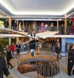 a group of people standing in a building