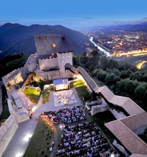 an aerial view of a building with a crowd of people