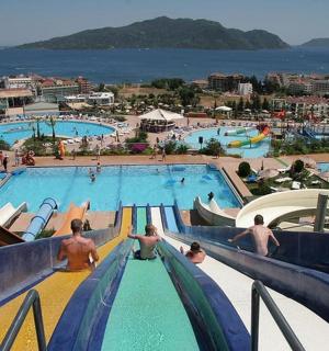 a group of people in a pool at a resort