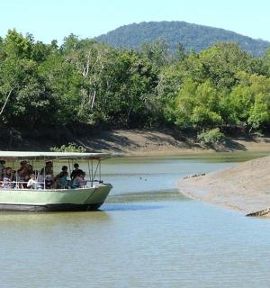 a group of people on a boat on a river