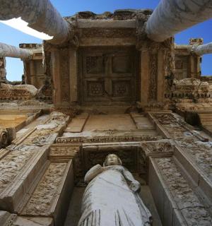 a large building with a statue in the middle