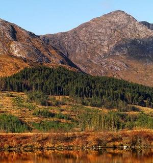 a view of a mountain with a body of water