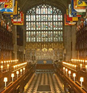 a large cathedral with candles and a large window