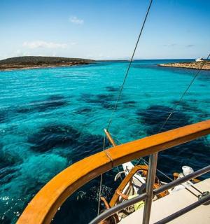 a view of the ocean from the bow of a boat