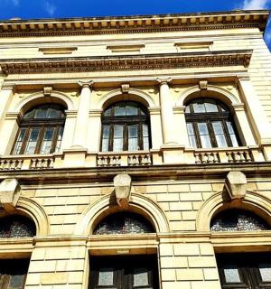 a tall building with windows on top of it