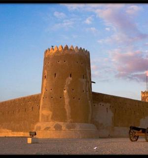 a castle with a horse drawn carriage in front of it