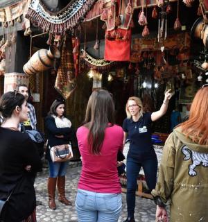a group of people standing in front of a store