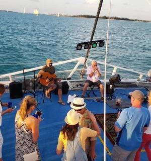a group of people on a boat in the water