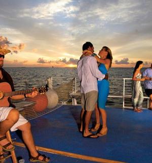 a group of people on a cruise ship playing guitar
