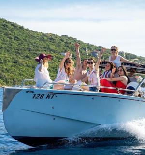 a group of people on a boat in the water
