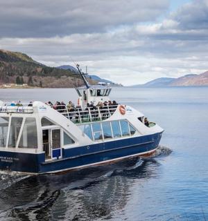 a group of people riding a boat on the water
