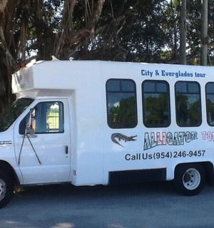 a white food truck parked in a parking lot