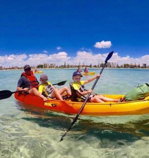 a group of people in a kayak in the water