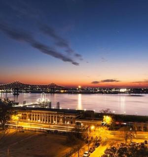 a view of a river at night with a city