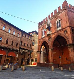 a large brick building with a courtyard in front of it