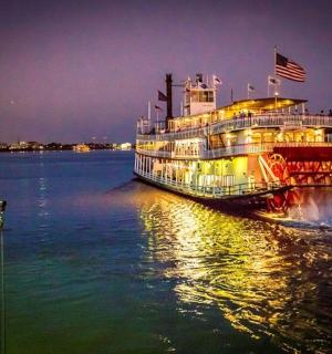 a cruise ship on the water at night